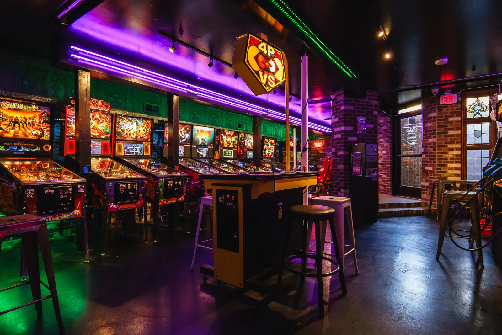 The colorful arcade floor at Stella's Pinball in Greeley